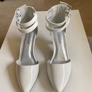 Classique woman two inch pump heels white patent and leather size 8wide.